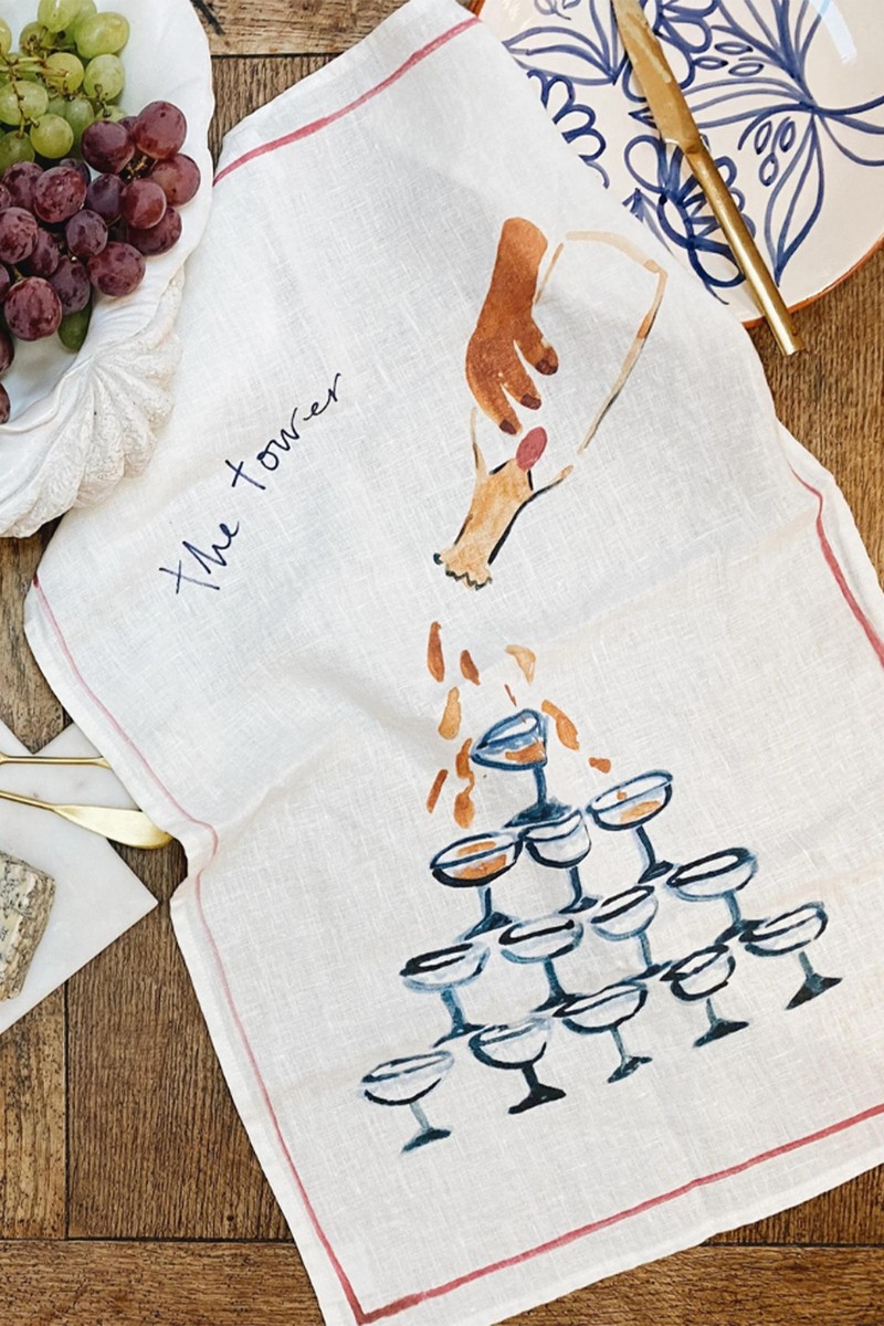 The Champagne Tower Linen Tea Towel from Ofelia Botella X Love & Honor
