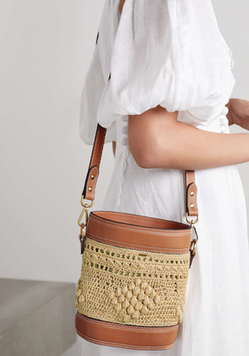 The Drawstring Mini Leather-Trimmed Straw Bucket Bag from Zimmermann