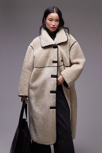 Oversized Faux Shearling Midi Coat With Brown Contrast Edging from ARKET