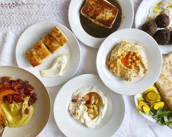 Mezze Platter Of Labneh, Confit Garlic, Potato Latkes, Fried Honey Halloumi & Laffa Bread