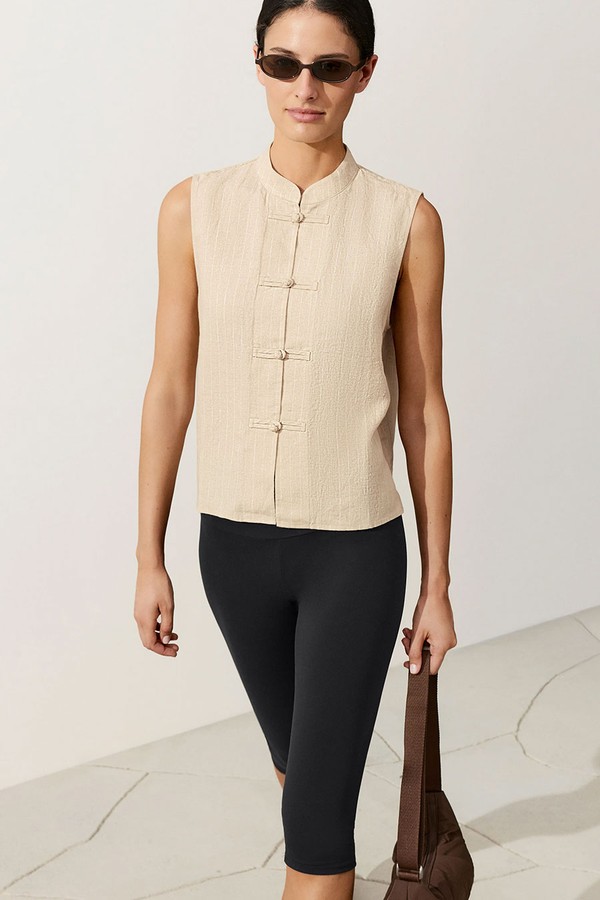 Sleeveless 100% Linen Stand-Up Collar Shirt With Buttons from oysho