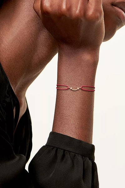 Smile Bracelet In Rose Gold On A Red Cord