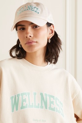 Wellness Ivy Embroidered Cotton-Twill Baseball Cap, £65 | Sporty & Rich