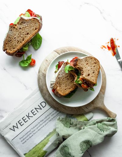 Bacon sandwich with tomatoes, avocado, rocket and rye sourdough