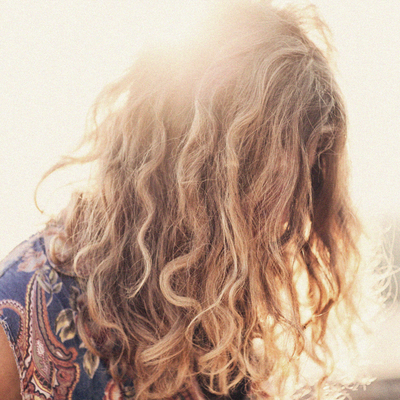Products & Tips To Tame Frizzy Hair 