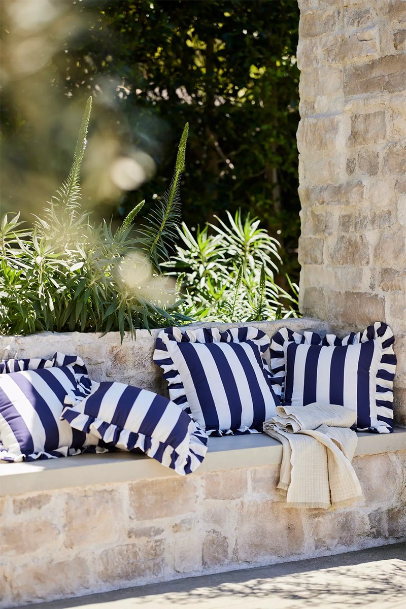 Maeve Striped Ruffle Indoor Outdoor Cushion from Anthropologie