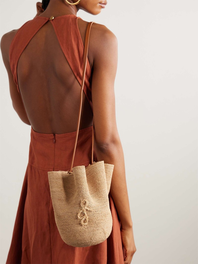 The Hatbag Leather-Trimmed Raffia Bucket Bag from RUSLAN BAGINSKIY