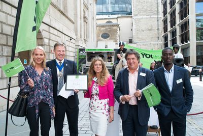 Founder & Editor Georgie Coleridge Cole receives the Key4Life YOUNITED Flag award on behalf of SheerLuxe