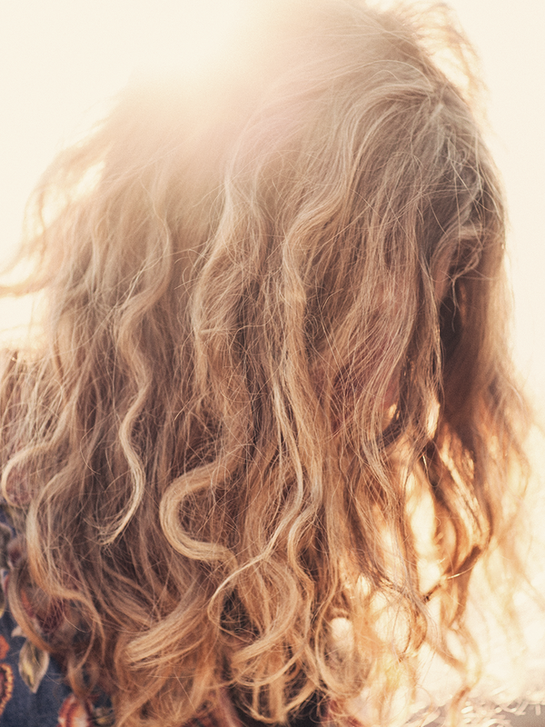 An Expert Guide To Tackling Frizz In The Heat