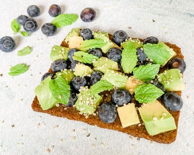 Avocado and blueberries with mint on toast