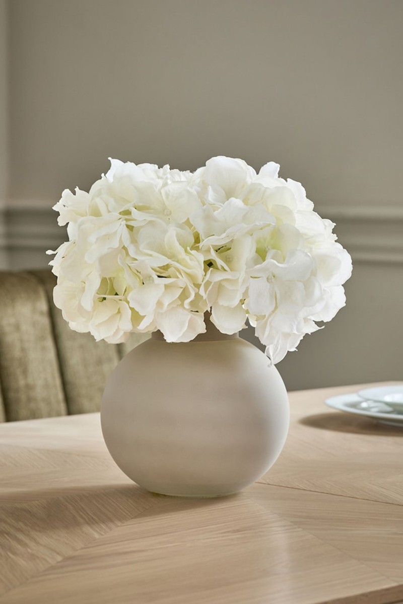 Artificial Hydrangea Arrangement In A Large Glass Vase
