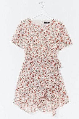 Floral Open back short sleeve playsuit from Nasty Gal