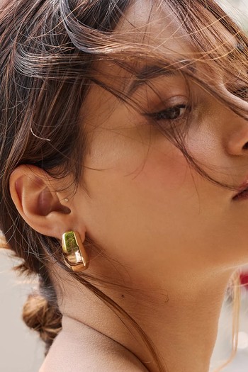 Sleek Crescent Hoop Earrings, £38 | Anthropologie