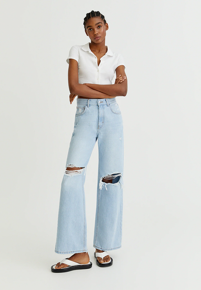 Flared High-Waist Jeans With Rips On The Knee  from Pull & Bear 