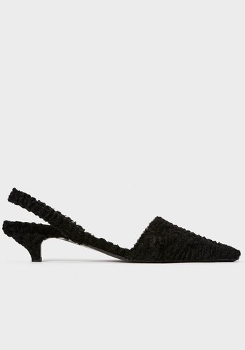 The Slingback Mule faux shearling from Totême