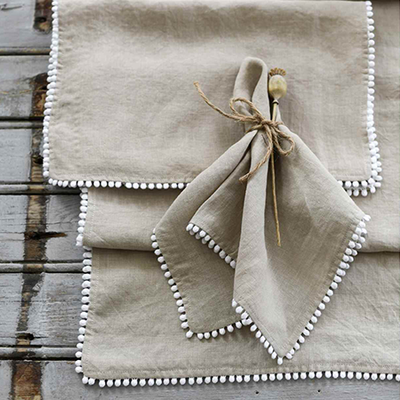 Natural Pom Pom Table Linen from Nordic House 